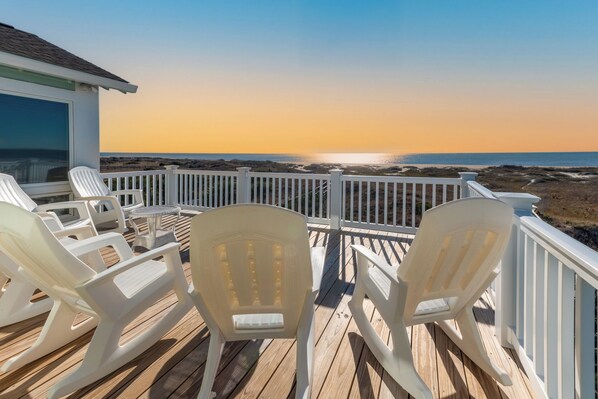 Relax on the deck with a clear view of the ocean.