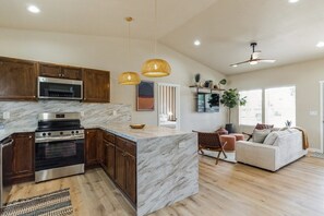 Bright open kitchen with generous counter space and pendant lighting. - Desert Bliss - Stylish Kennewick Getaway (Kennewick)