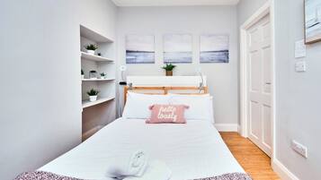 1 bedroom, desk, iron/ironing board, travel crib