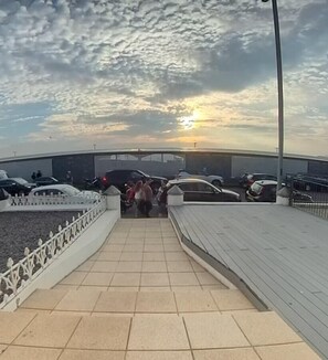 Enjoy panoramic views from this rooftop terrace with a tiled floor and parking area nearby.