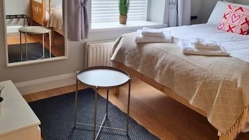 1 bedroom, desk, iron/ironing board, travel crib