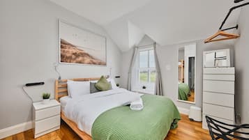 1 bedroom, desk, iron/ironing board, travel crib