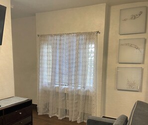 Living area - This unit has a separate living room with a pull out sofa for your guest& kiddos (Daytona Beach)