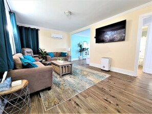 Smart TV, fireplace, books, stereo