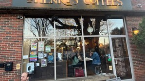 A storefront with a sign reading 'Henry's Coffees.'