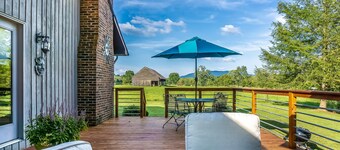 Riverfront home with dock, mountain view, grill, firepit, smart TVs
