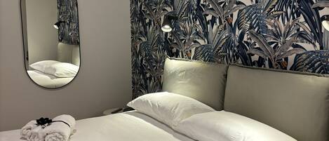 1 bedroom, desk, iron/ironing board, travel crib