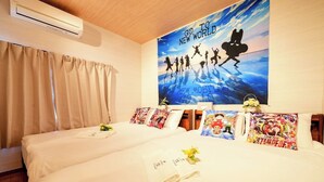 A hotel room with two beds, a large poster on the wall, and a window with curtains.