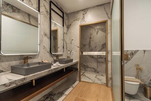 A modern bathroom with two sinks, a large mirror, and a shower area. - MiraVita Hotel - Adults Only (Chania)