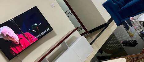 Business Apartment | Living area | 32-inch Smart TV with digital channels