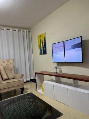 Business Apartment | Living area | 32-inch Smart TV with digital channels - Lux Suites Mango Court Apartments (Nairobi)