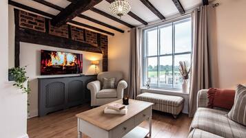 Apartemen, 2 kamar tidur | Area keluarga | TV layar datar