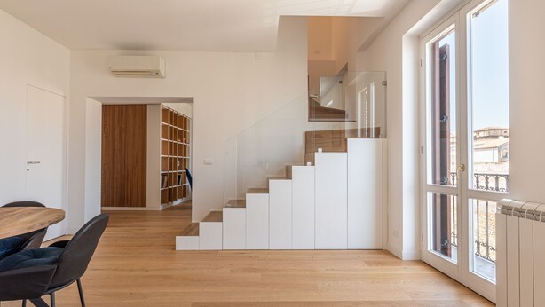 A modern interior with a staircase, wooden flooring, and large windows. - Oretea Apartment With Terrace by Wonderful Italy (Palermo)