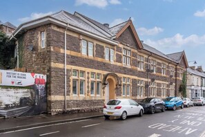 A stone building with a sign reading "History is ours for the making." - Madison House - Converted Church 5 Bed Pontypool (Torfaen Principal Area)