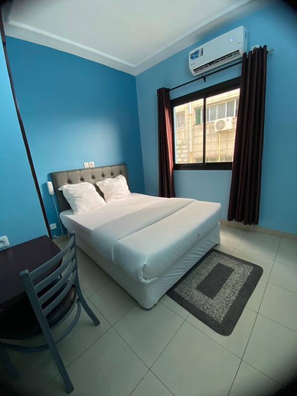 Habitació doble estàndard | Cortines opaques, planxa i posts de planxar i wifi gratuïta