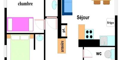 A floor plan with two bedrooms, a bathroom, a living room, a kitchen, and a WC.