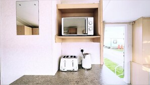 Cabin | Private kitchen | Fridge, microwave, oven, stovetop