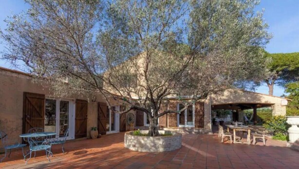 A courtyard with a tree, outdoor seating, and a covered area. - Authentic Provencal Villa with Pool For a Perfect Family Retreat (La Ciotat)