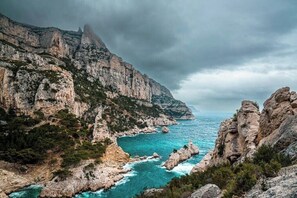 On the beach, sun-loungers
