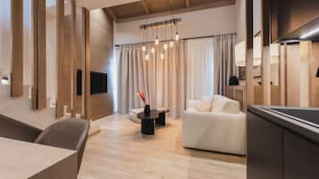 Family Suite with Loft and Mountain View | Living area | TV