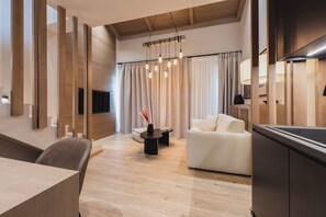 Family Suite with Loft and Mountain View | Living area | TV