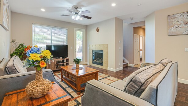 A living room with a sofa, coffee table, and TV. - Spacious Bay Point Family Home w/ Private Yard! (Pittsburg)