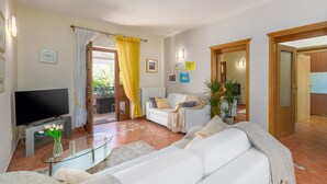 A living room with a TV, white sofa, and a glass coffee table. - Sophia near Porec big private Garden (Nova Vas)