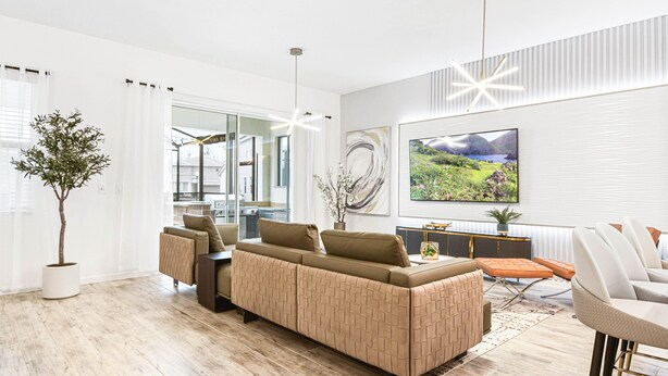 A modern living room with a large sofa, a dining area, and a large window with curtains. - Last Minute Disney! Private Pool, Hot Tub, Game Room & Themed Bedrooms. Book Now! #112541 (Orlando)