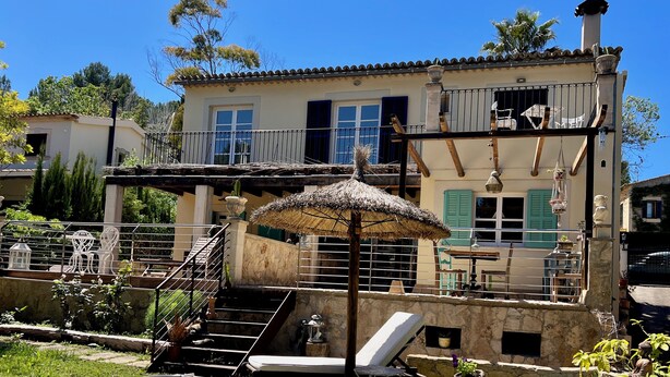 A pool area with a hot tub, lounge chairs, and a staircase leading to a balcony. - Villa in Nature with Yoga Room, Peace and Tranquility (Puigpuñent)