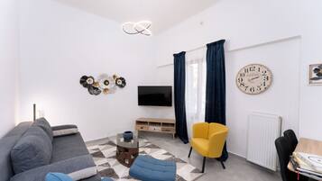 Deluxe Apartment, Balcony, City View | Living area | 43-inch flat-screen TV with digital channels