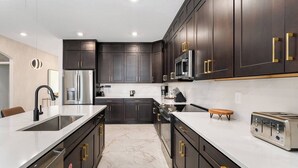 Coffee/tea maker, fridge, microwave, oven - The Stylish | NEW Home w Designer Decor, PVT Pool & Theme BR - Mins to Universal (Orlando)