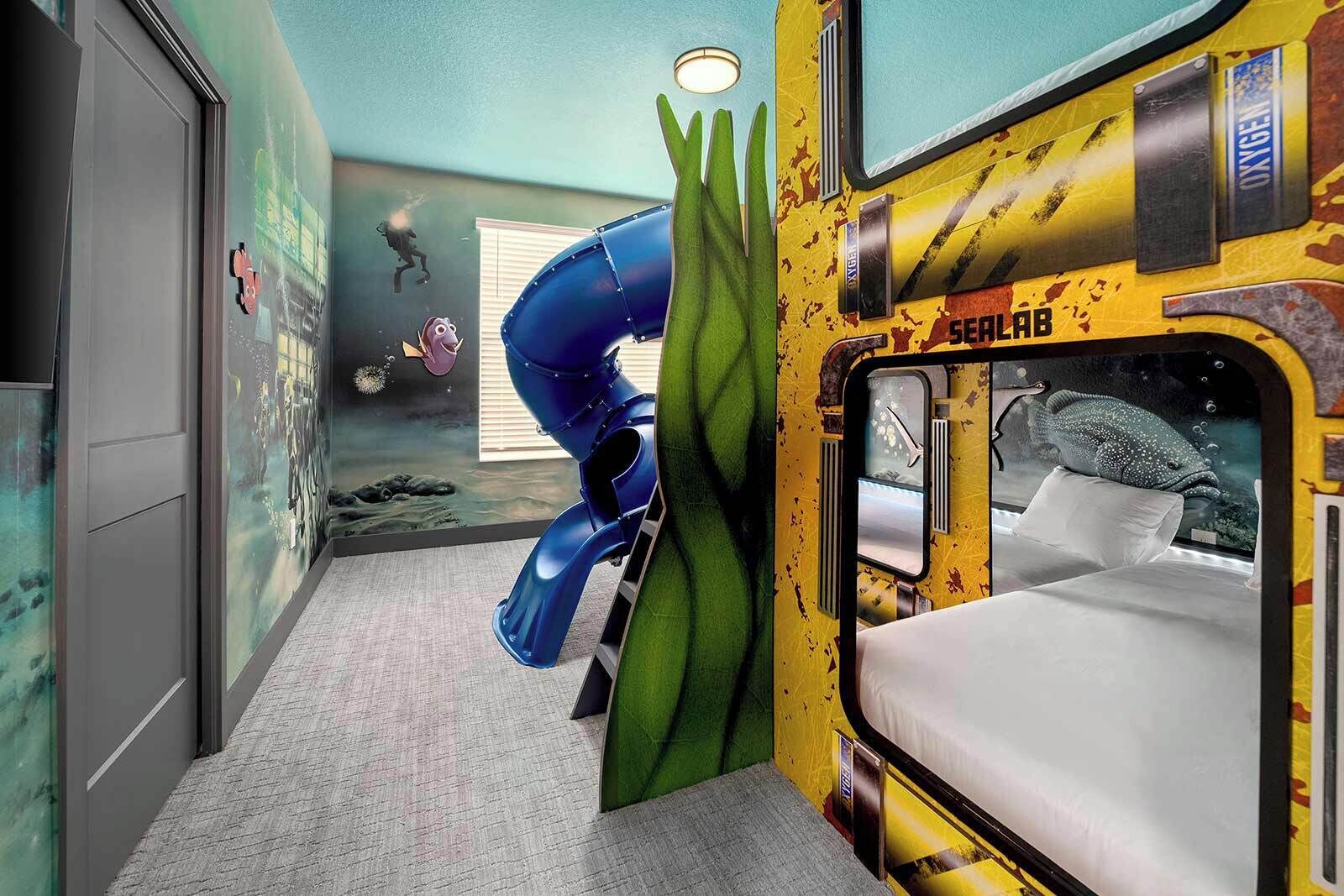 A room with a bed, a window, and a mural of a diver.
