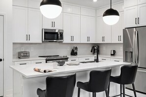 Fridge, microwave, oven, stovetop - Leo's Loft | Chic Home Near Disney w/ Luxe Suites, Huge LR/DR, Dragon BR & Pool (Orlando)