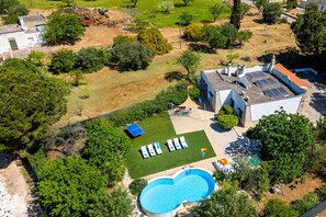 An aerial view of a property with a swimming pool, a tennis court, and a covered patio area. - Villa Ambra by Villa Plus (San Vito dei Normanni)