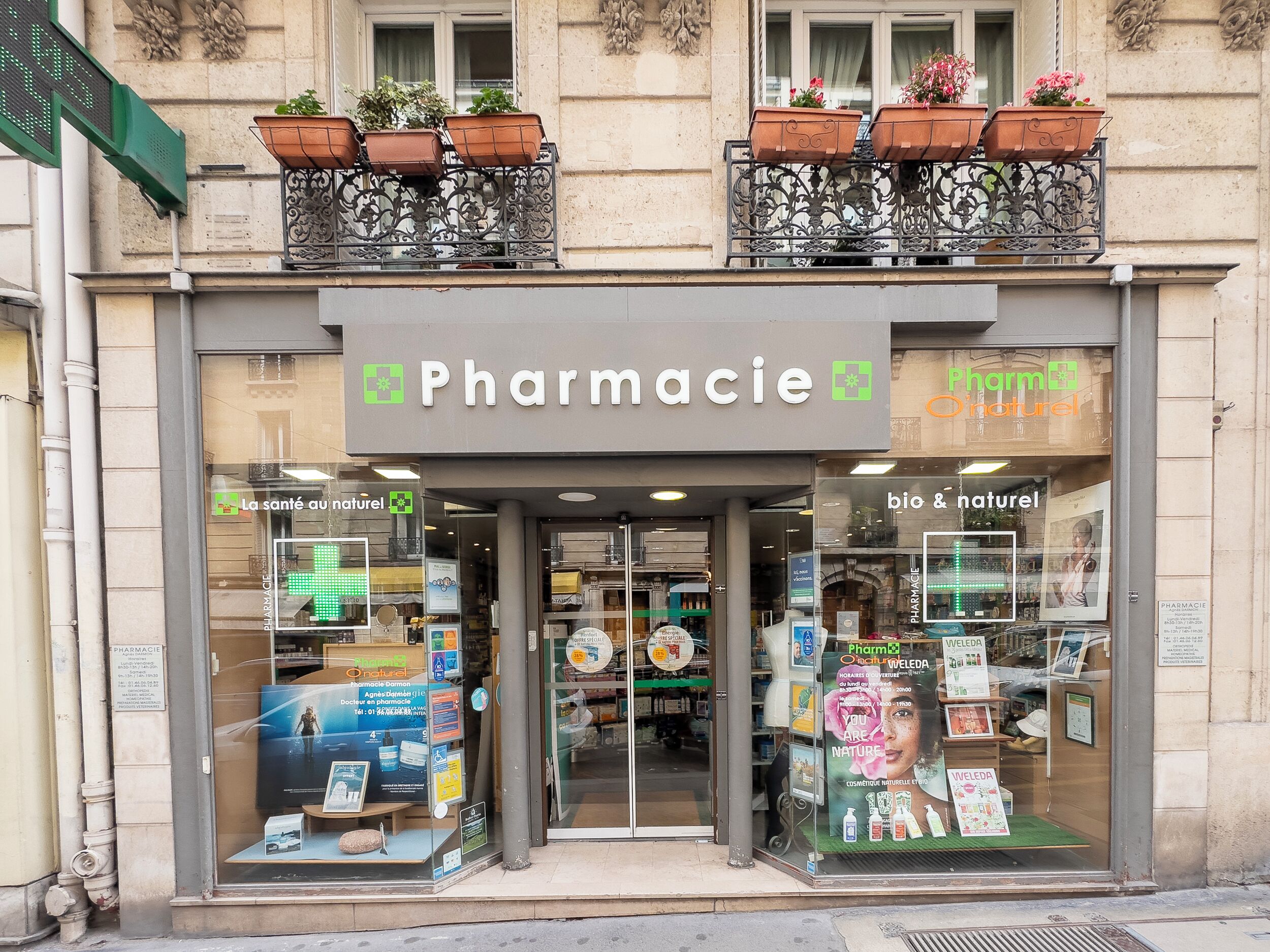 A storefront with a sign reading "Pharmacie" and "bio & naturel".