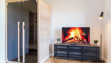 Family Apartment | Living area | 42-inch Smart TV with satellite channels, Netflix, toys