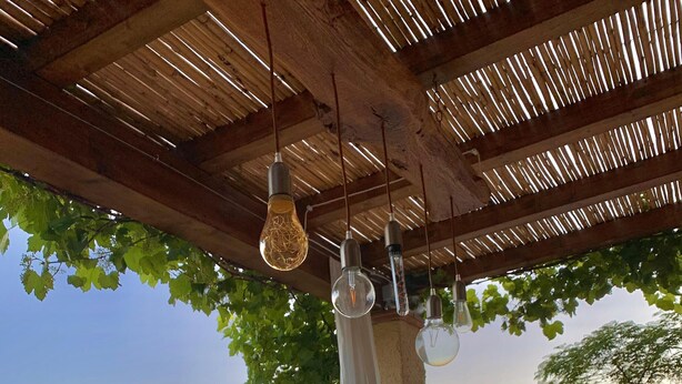 An outdoor dining area with a table set for a meal, overlooking a scenic view. - Nice rustico with see view (Canal D'oro)