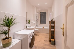 Hair dryer, towels - Stylish old building apartment designed by Bevo (Berlin)