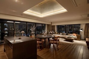 A modern living room with a dining area, large windows, and a high ceiling. - HIDEOUT (Kyoto)