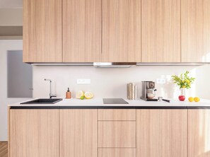 Coffee/tea maker, fridge, stovetop, dishwasher