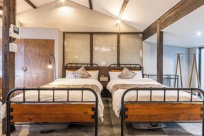 A room with two wooden beds, a wooden wardrobe, and a large window with a view. - Rent Tsuruhashi (Osaka)