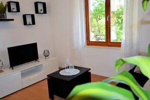 Appartamento | Area soggiorno | TV