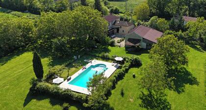 Cozy cottage in a green and peaceful setting.