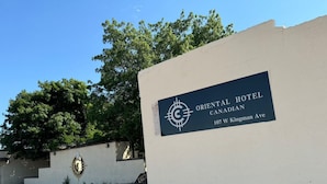 A sign for Oriental Hotel Canadian on 107 W Kingman Ave. - Oriental Hotel (Canadian)