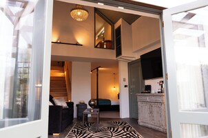 Junior Suite | Living area | 55-inch Smart TV with digital channels, Netflix, streaming services