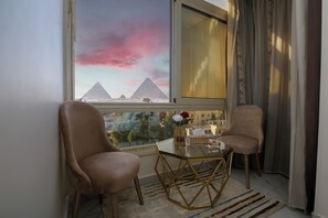 Comfort Triple Room | Minibar, individually decorated, individually furnished, desk - pyramids palace inn (Giza)