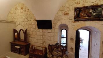 Family Triple Room, Garden View | In-room safe, individually decorated, desk, soundproofing