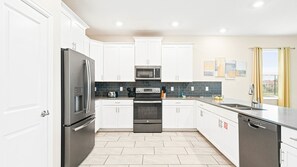 House, Multiple Beds, Pool Access, Pool View (8834CCD CG) | Private kitchen | Coffee/tea maker - Exclusive Champions Gate Retreat w/ Private Pool (Davenport)