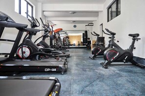 Work out in style with our fully equipped gym featuring stationary bikes and treadmills.