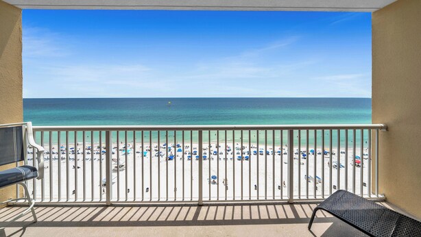 A balcony with a view of a beach. - FREE Golf&Perks! Majestic Tower 1-910, 5 Pools, 3 Hot Tubs, Theater & Tennis! (Panama City Beach)